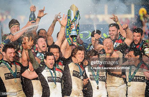 Luke Wallace of Harlequins lifts the trophy with team mates after the LV= Cup Final between Sale Sharks and Harlequins at Sixways Stadium on March...