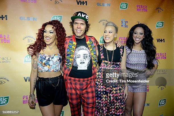 Karis Anderson, Perez Hilton, Courtney Rumbold and Alex Buggs of Stooshe pose on the red carpet for Perez Hilton's One Night In Austin event at the...