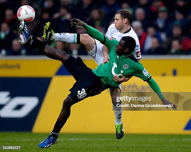 Tony Jantschke of Moenchengladbach and Mame Biram Diouf of Hannover battle for the ball during the Bundesliga match between VfL Borussia...