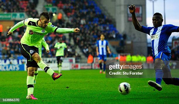 Newcastle player Davide Santon fires in his goal during the Barclays Premier League match between Wigan Athletic and Newcastle United at DW Stadium...