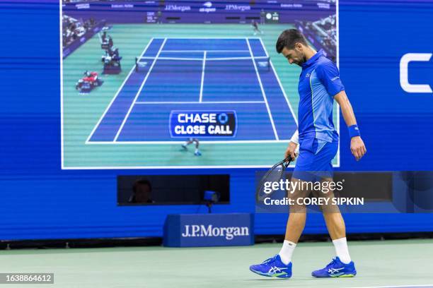 Serbia's Novak Djokovic walks to the baseline during his US Open tennis tournament men's singles third round match against Serbia's Laslo Djere at...