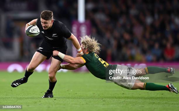 Beauden Barrett of New Zealand breaks past Faf de Klerk of South Africa during the Summer International match between New Zealand All Blacks v South...