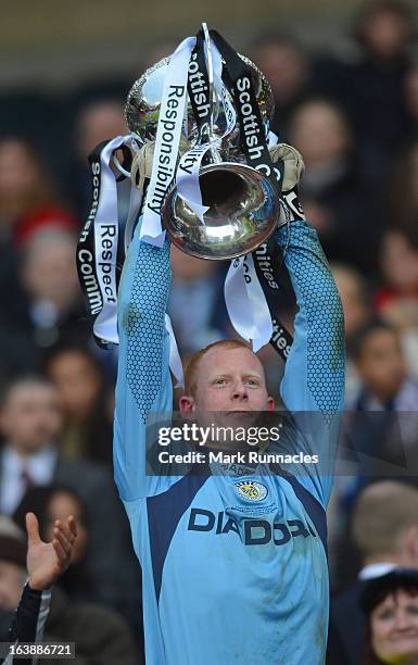 Graig Samson of St Mirren celebrates with the Scottish Communities League Cup after victory in the Scottish Communities League Cup Final between St...