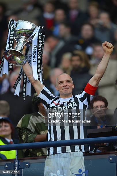 Jim Goodwin of St Mirren celebrates with the Scottish Communities League Cup after victory in the Scottish Communities League Cup Final between St...