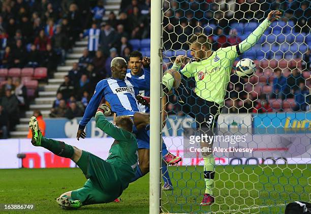 Arouna Kone of Wigan Athletic scores the winning goal during the Barclays Premier League match between Wigan Athletic and Newcastle United at the DW...