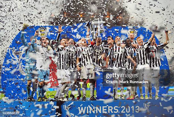 The St Mirren team celebrate after their sides triumph in the Scottish Communities League Cup Final between St Mirren and Hearts at Hampden Park on...