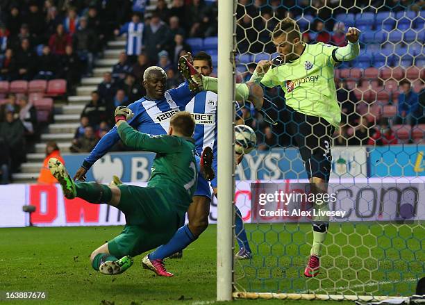 Arouna Kone of Wigan Athletic scores the winning goal during the Barclays Premier League match between Wigan Athletic and Newcastle United at the DW...