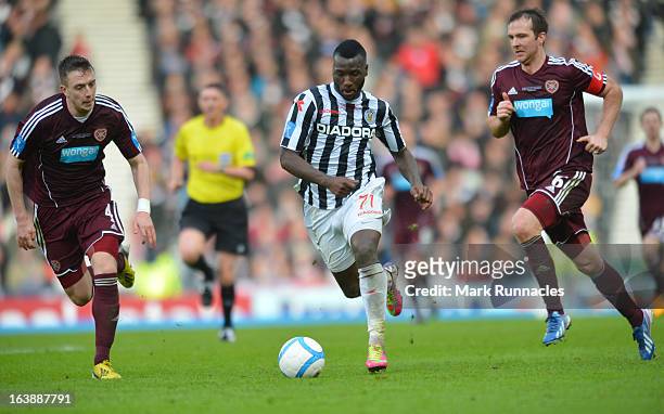 Esmael Goncalves of St Mirren and Andy Webster and Danny wilson of Hearts during the Scottish Communities League Cup Final between St Mirren and...