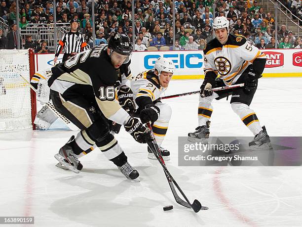 Brandon Sutter of the Pittsburgh Penguins battles for the puck against Andrew Ference of the Boston Bruins on March 17, 2013 at Consol Energy Center...