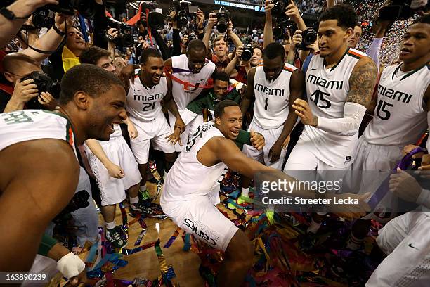 Kenny Kadji of the Miami Hurricanes celebrates with teammates after they won 87-77 against the North Carolina Tar Heels during the final of the Men's...