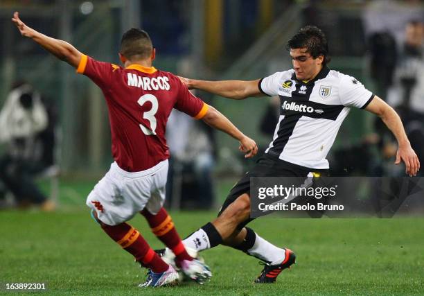 Alvaro Ampuero of Parma FC competes for the ball with Marquinhos of AS Roma during the Serie A match between AS Roma and Parma FC at Stadio Olimpico...