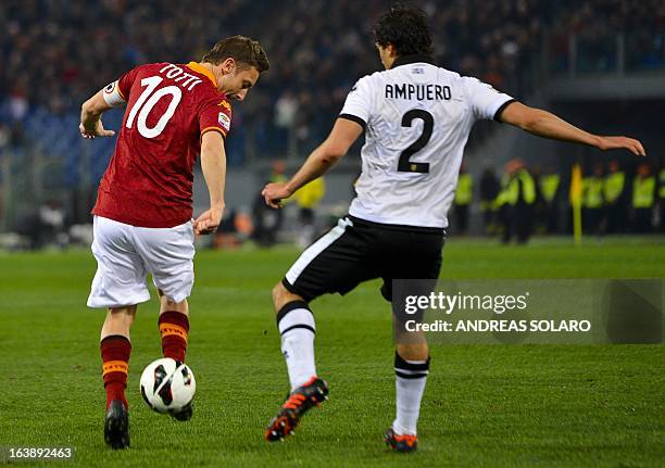 Roma forward Francesco Totti vies with Parma's Peruvian midfielder Alvaro Ampuero during the Italian Serie A football match AS Roma vs. Parma on...