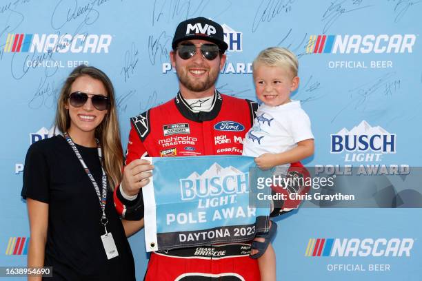 Chase Briscoe, driver of the Magical Vacation Planner Ford, poses for photos with his wife, Marissa Briscoe and son, Brooks Wayne Cunningham Briscoe...