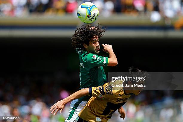 Efrain Velarde of Pumas struggles for the ball with Matias Britos of Leon during a match between Santos and Leon as part of Clausura 2013 Liga MX at...