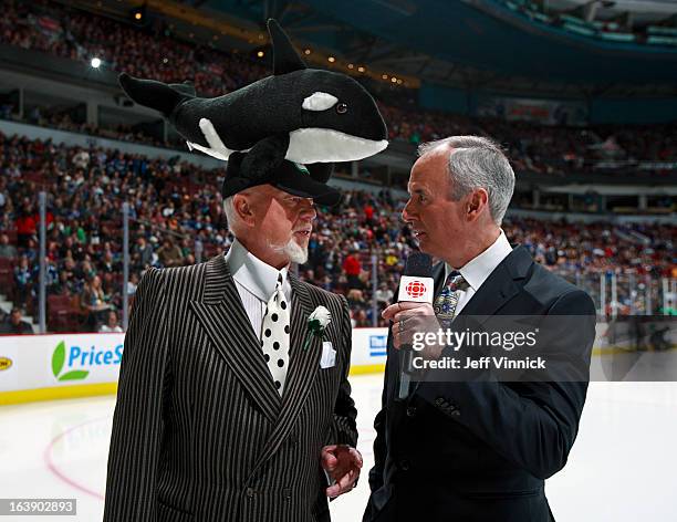 Commentators Ron MacLean and Don Cherry stand on the ice before the NHL game between the Vancouver Canucks and the Los Angeles Kings at Rogers Arena...