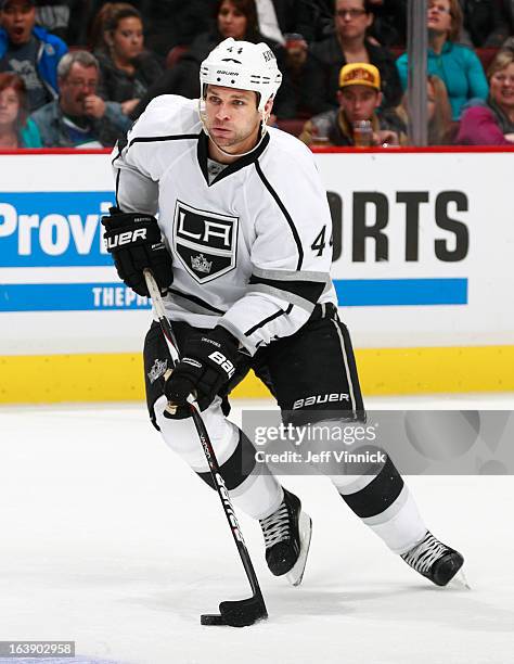 Davis Drewiske of the Los Angeles Kings skates up ice with the puck during their NHL game against the Vancouver Canucks at Rogers Arena March 2, 2013...