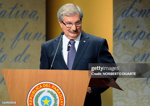 Paraguayan presidential candidates Miguel Carrizosa, of Patria Querida party gestures just before the start of a televised presidential debate on...