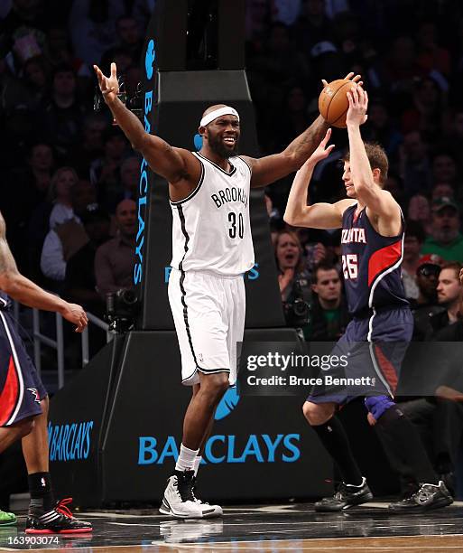 Reggie Evans of the Brooklyn Nets celebrates his second quarter basket against the Atlanta Hawks at the Barclays Center on March 17, 2013 in New York...