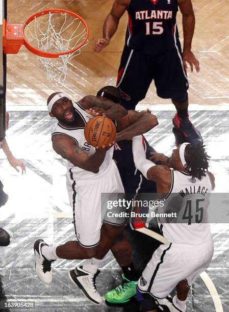 Reggie Evans of the Brooklyn Nets goes up for a basket in the first half against the Atlanta Hawks at the Barclays Center on March 17, 2013 in New...