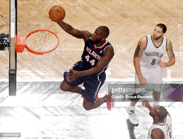 Ivan Johnson of the Atlanta Hawks scores two in the second half against the Brooklyn Nets at the Barclays Center on March 17, 2013 in New York City....