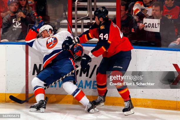 Erik Gudbranson of the Florida Panthers tangles with Colin McDonald of the New York Islanders at the BB&T Center on March 16, 2013 in Sunrise,...