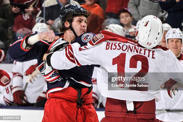 Jared Boll of the Columbus Blue Jackets fights against Paul Bissonnette of the Phoenix Coyotes on March 16, 2013 at Nationwide Arena in Columbus,...