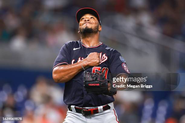 Joan Adon of the Washington Nationals reacts during the sixth inning of the game against the Miami Marlins at loanDepot park on August 25, 2023 in...