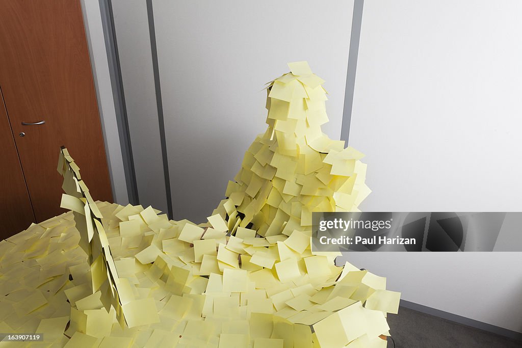 Man covered by Post It