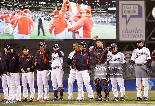 Japan players salute the crowd after losing to Puerto Rico in the semifinals of the World Baseball Classic at AT&T Park on March 17, 2013 in San...