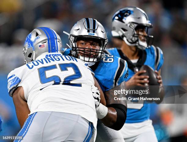 Chandler Zavala of the Carolina Panthers blocks Christian Covington of the Detroit Lions during the first half of a preseason game at Bank of America...