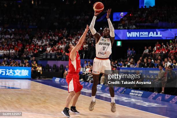 Dennis Schroder of Germany shoots a three point shot while under pressure from Yuki Togashi of Japan during the FIBA World Cup Group E game between...