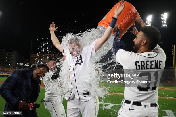 Parker Meadows of the Detroit Tigers takes a Gatorade dump from Riley Greene after his walk off three run home run to beat the Houston Astros 4-1 at...