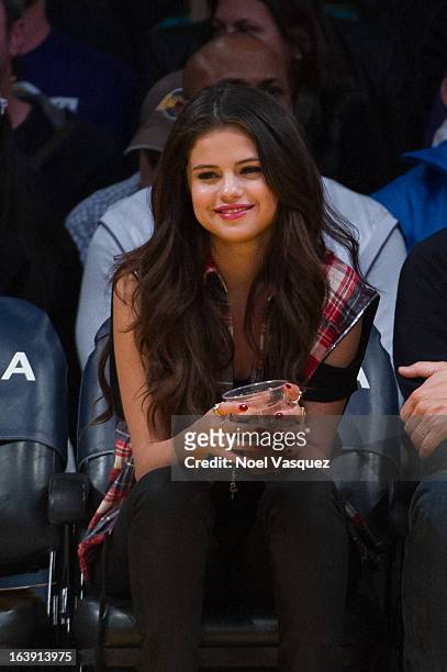 Selena Gomez attends a basketball game between the Sacramento Kings and the Los Angeles Lakers at Staples Center on March 17, 2013 in Los Angeles,...