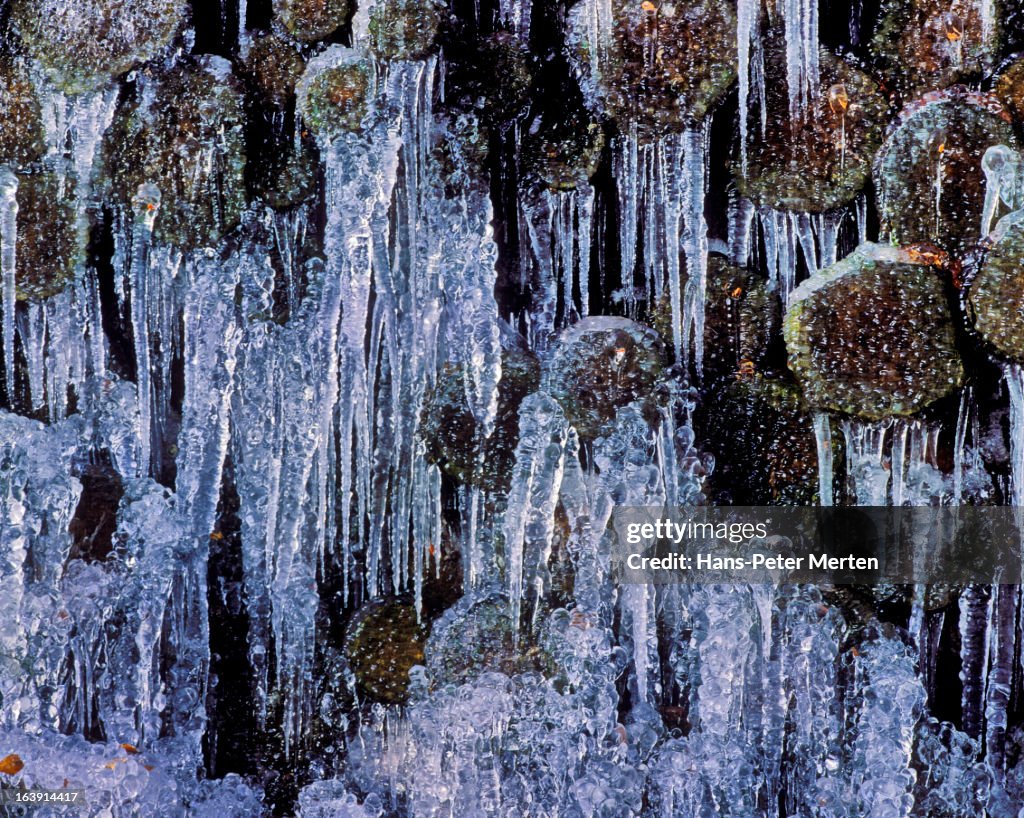 Stacked logs with icicles