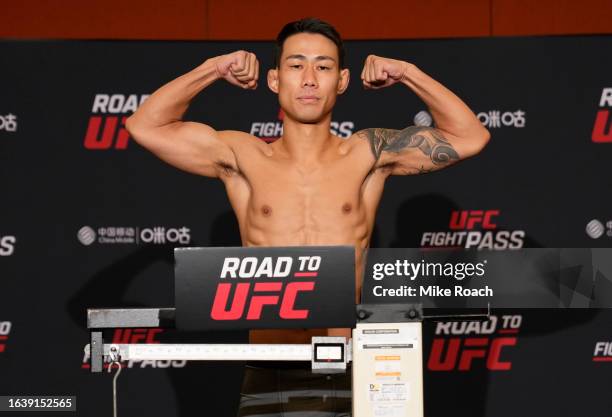 SeungGuk Choi of South Korea poses on the scale during the Road to UFC weigh-in at Resorts World Convention Centre on August 26, 2023 in Singapore.