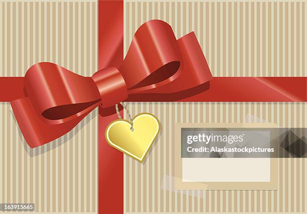 present with gold heart. - geschenkband stock illustrations