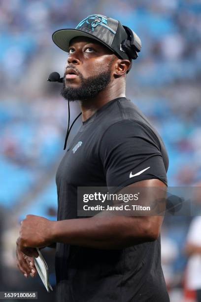 Carolina Panthers offensive coordinator Thomas Brown looks on during the first quarter of a preseason game against the Detroit Lions at Bank of...
