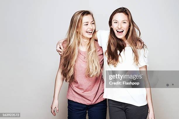 studio portrait of two women who are best friends - two girls bildbanksfoton och bilder