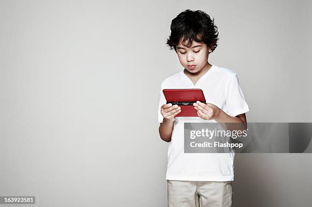 portrait of boy using computer tablet - child standing stock pictures, royalty-free photos & images