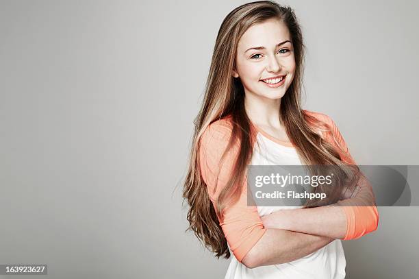 studio portrait of girl - blonde girl smiling stock-fotos und bilder