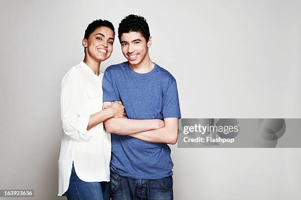 portrait of mother and son - studio relations stock pictures, royalty-free photos & images