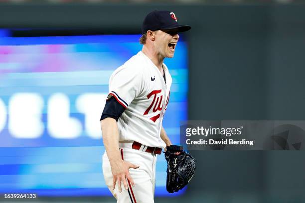 Sonny Gray of the Minnesota Twins celebrates recording a strikeout against Austin Hedges of the Texas Rangers in the seventh inning at Target Field...