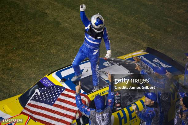 Justin Allgaier, driver of the Hellmann's Chevrolet, and crew celebrate after winning the NASCAR Xfinity Series Wawa 250 powered by Coca-Cola at...