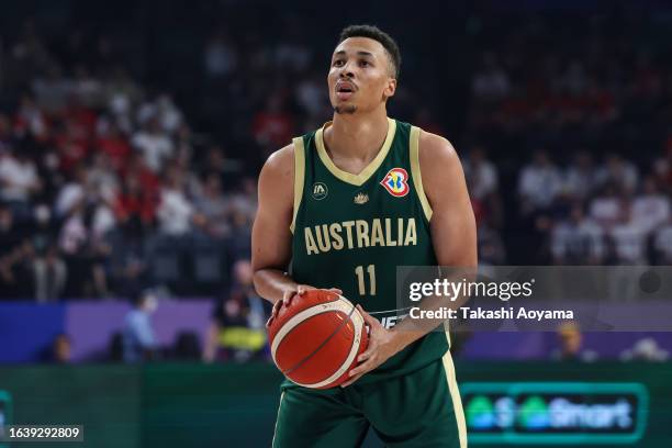 Dante Exum of Australia shoots a free throw during the FIBA World Cup Group E game between Finland and Australia at Okinawa Arena on August 25, 2023...