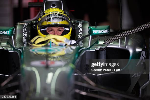 Nico Rosberg of Mercedes and Germany sits in the cockpit in the garage during the Australian Formula One Grand Prix at the Albert Park Circuit on...