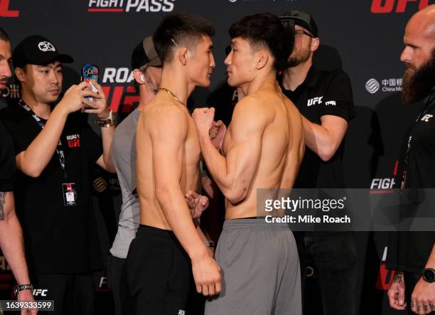 Opponents Daermisi Zhawupasi of China and ChangHo Lee of South Korea face off during the Road to UFC weigh-in at Resorts World Convention Centre on...