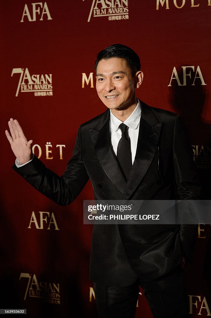 Andy Yu Hong Kong actor Andy Lau poses on the red carpet of the 7th Asian ...