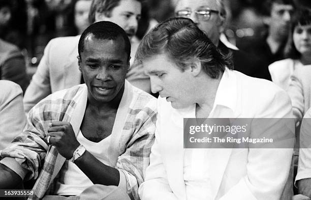 Sugar Ray Leonard talks with Donald Trump before the fight between Mike Tyson and Michael Spinks at the Convention Hall on June 27, 1988 in Atlantic...