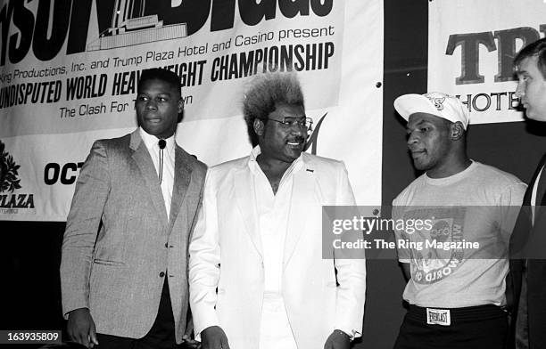 Tyrell Biggs, Promoter Don King, Mike Tyson and Donald Trump pose during the press conference to promote the fight between Mike Tyson and Tyrell...