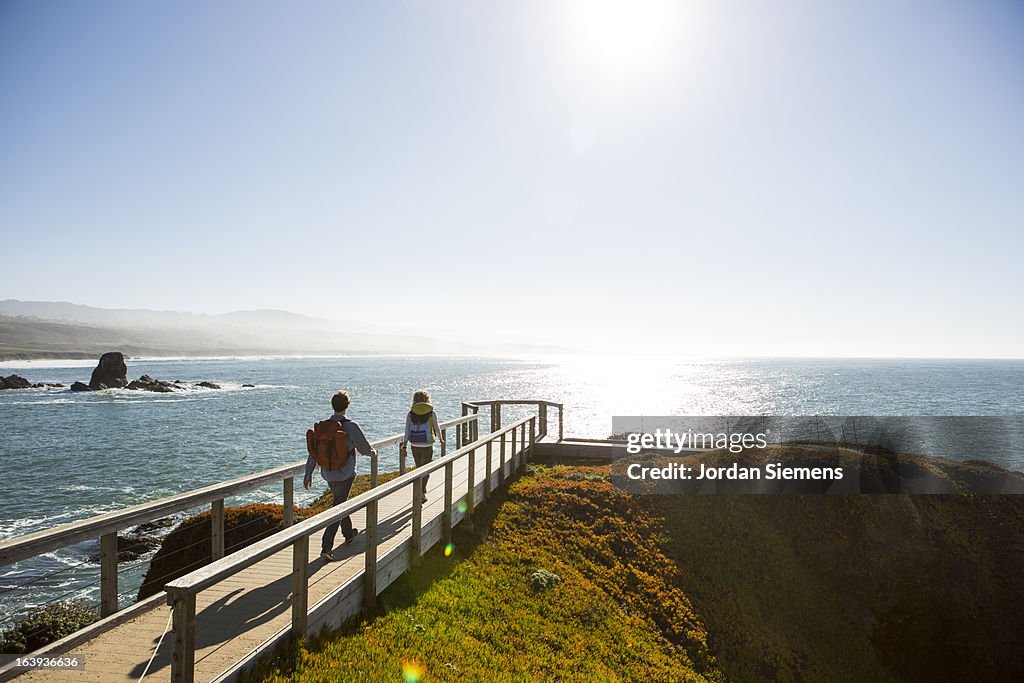 A couple hiking the California coast.